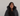 customer wearing her gray sloodie in front of a white background