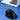 large ergonomic black travel mouse with laptop in background