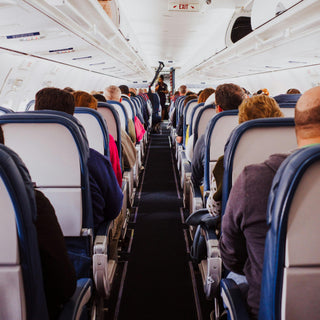 Airplane aisle view. how to get good rest on an airplane 