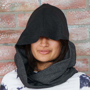 charcoal gray and black sleep hoodie worn with hood up by female